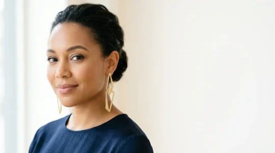 Elegant woman with round face wearing long linear drop earrings