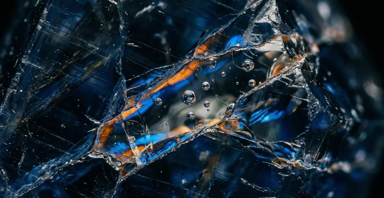 Microscopic view of glass-filled fractures in treated sapphire