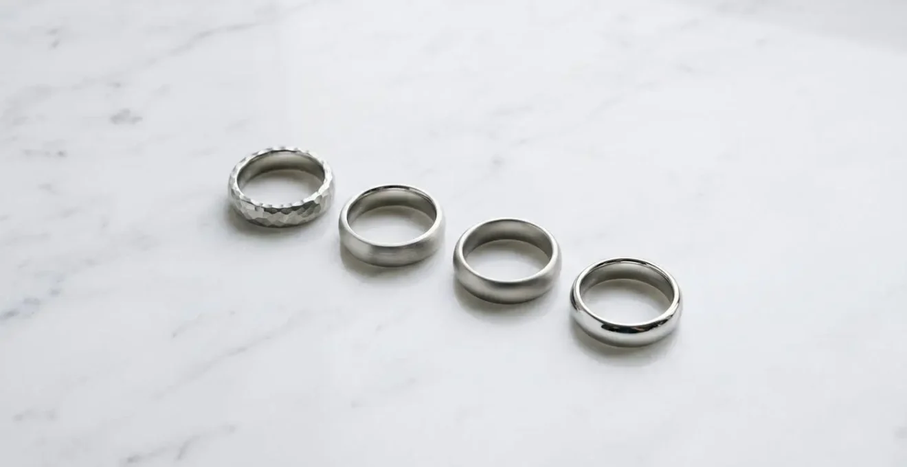 Macro comparison of different metal ring finishes showing wear patterns