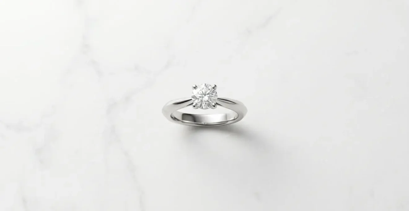 Top view of solitaire ring with tapered band creating visual size enhancement