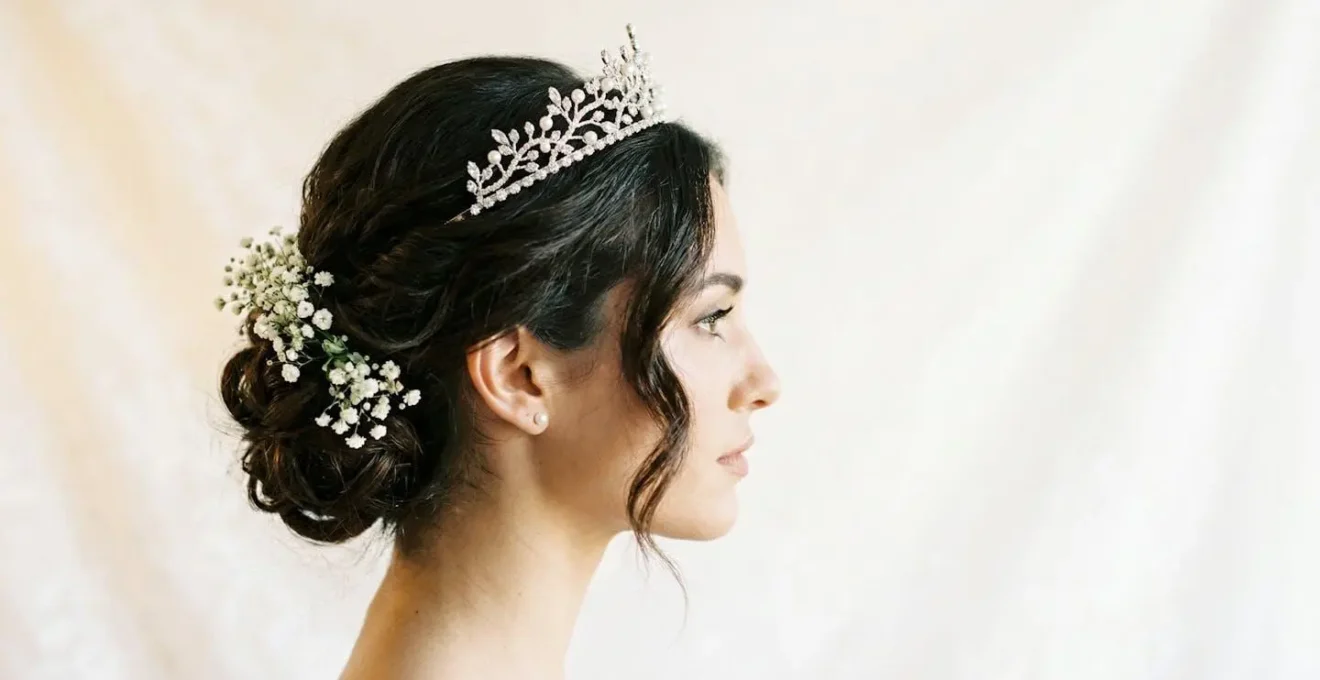 Side profile of bride showing proper tiara placement with elegant updo